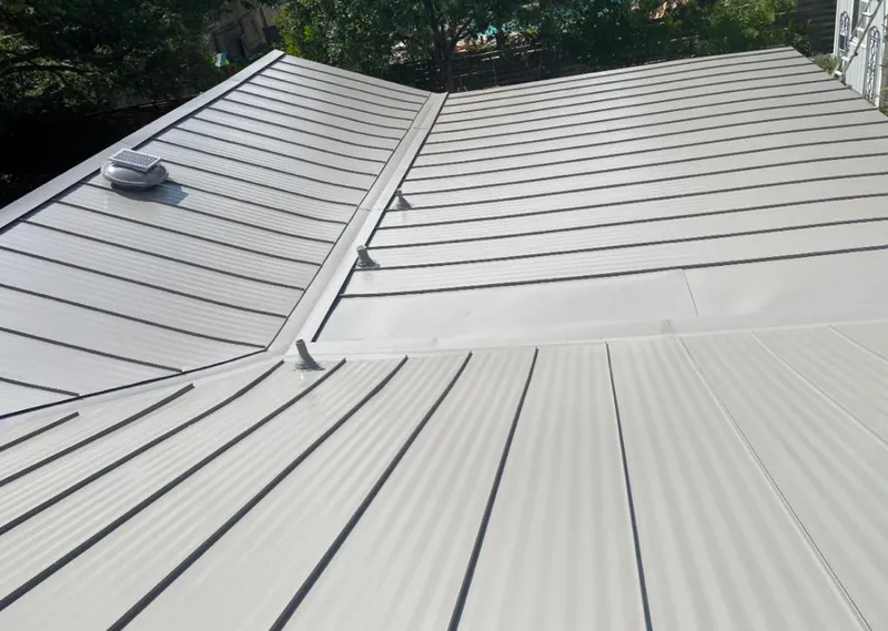 Solar attic fan installed on a metal roof for Roof Ventilation in Latrobe
